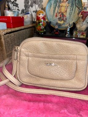EUC MultiSac brand crossbody bag features multiple zippered compartm